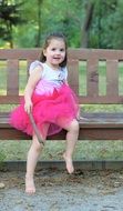 little girl in a fluffy pink skirt