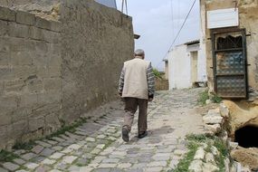 picture of the man is walking on Old Street