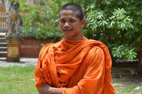 portrait of a friendly monk among nature