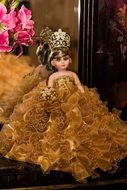 Doll wearing Crown and luxury Dress