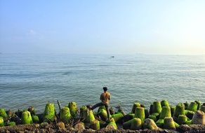 man Fishing on beach, indonesia, semarang