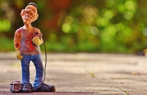 funny tattoo artist as a figure in the park