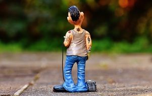 tattoo artist as a figure in the park on blurred background