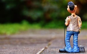 stylish tattoo artist as a figure in the park