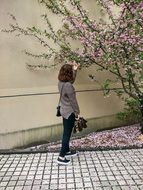 young girl at blooming tree