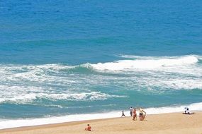 people on beach at serfline