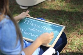 Girl Writing in frame