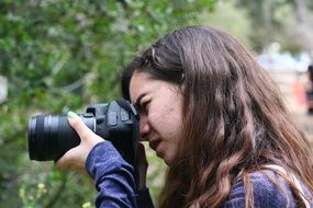 portrait of girl with a professional camera