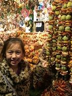 Girl in shop with the fruits