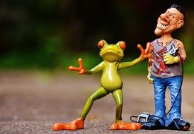 tattoo artist and frog as figures in the park