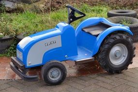 blue toy tractor outdoor