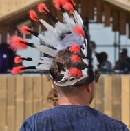 man in indian war bonnet