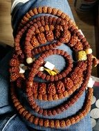 brown Beads on personâs lap