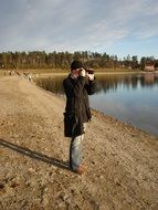 nice Man Photographer near the water