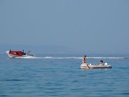 People on the boat on the seaside