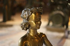 Golden girl sculpture
