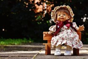 doll like a cute girl on a bench