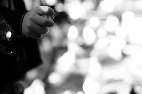 black and white photo of a childâs hand