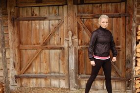blonde girl near the barn
