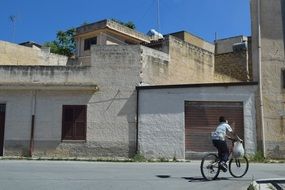 Child with the bike in Mediterranean