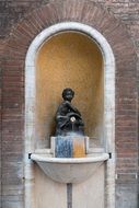 statue of a child on the fountain