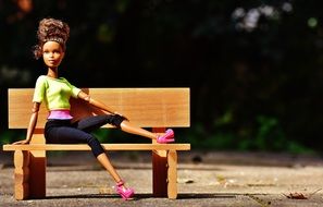 doll like a beauty on a bench