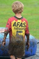 blond baby in the mud