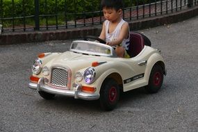 child on a miniature car, vietnam