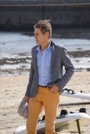 Colorful man on the sandy beach