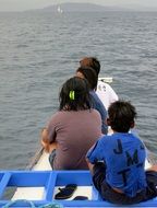 Family on a boat in ocean