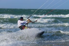 sporty man likes kitesurfing