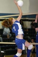 young girl playing volleyball