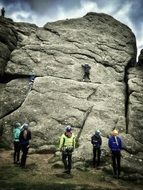 climbers on the background of a high rock