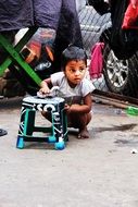 child cleans chair