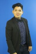 portrait of a handsome young man on a blue background