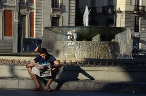 Boy Reading Newspaper