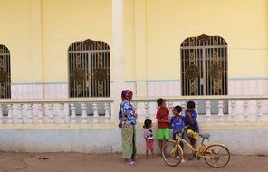 poor family on the background of a mosque in Cambodia