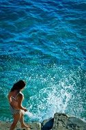woman near turquoise water