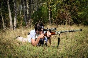 young man with rifle