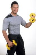 smiling muscular man with yellow dumbbells at white background