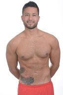 smiling muscular man in red shorts