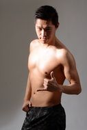 sporty asian man with torso