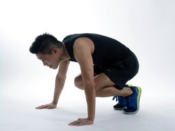 athlete in a squat pose