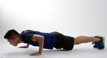 athlete in a low plank position