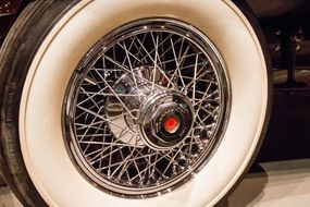 chrome spoke on the wheel of a retro car