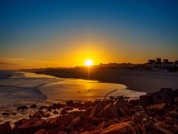 scenic Blue and golden Sunset above Ocean beach, south africa