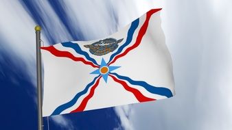 Clipart of Assyrian Flag on blue sky background with white clouds