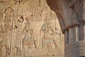 hieroglyphs and pharaohs on the walls of the Egyptian temple