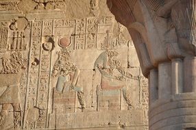 hieroglyphs and pharaohs on the walls of the Egyptian temple