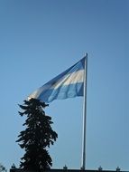 Argentinian flag over the city